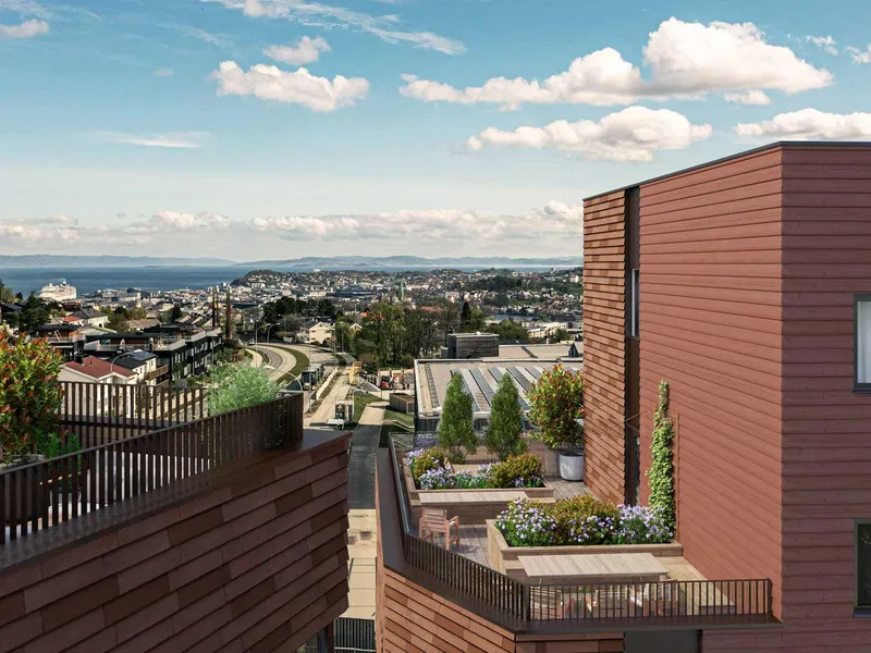 Illustrasjon, boligblokker, terrasser, blå himmel , fugleperspektiv, åser, sjø i horisonten