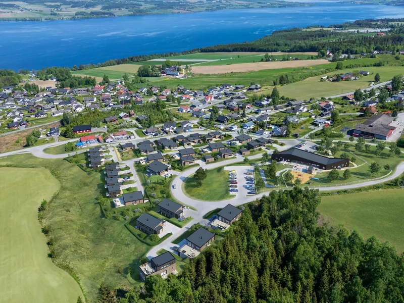 Mesterhus Innlandet vil bygge 31 boliger på nabotomten til den nye barnehagen.. 3D illustrasjon av Nordlifeltet: Mesterhus Innlandet.