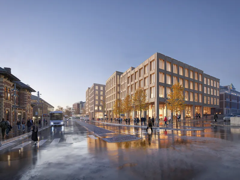 Lillehammer jernbanestasjon til venstre, Lillehammer skysstasjon i midten og ny bebyggelse med næring og science park til høyre i bildet.